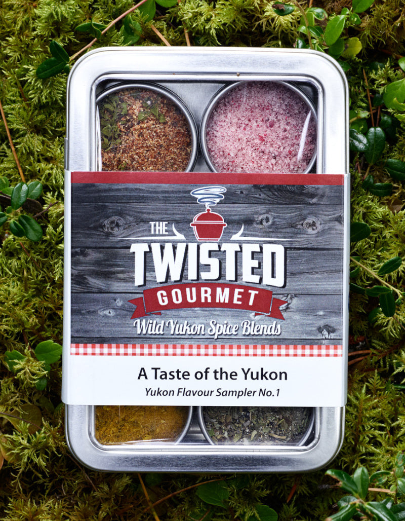 Gift set: six small tins containing Yukon made Twisted Gourmet spices in a hinged tin. 